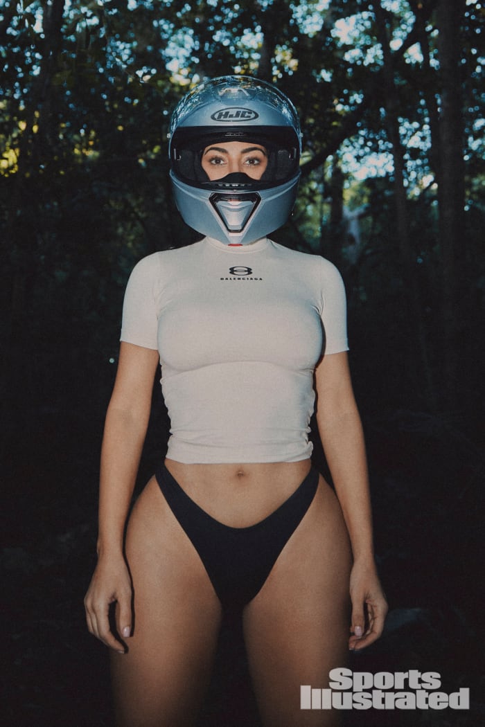 Kim Kardashian was photographed by Greg Swales in the Dominican Republic. Swimsuit by SKIMS. Top by Balenciaga. Helmet by HJC.